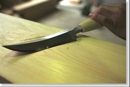 The curved, razor-sharp yariganna, or spear plane, is but one of the traditional tools that the miya-daiku must master. (Courtesy Mitsunari Sakurai)