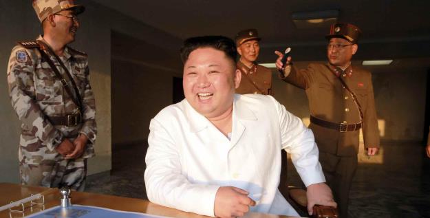 Kim Jong-un inspects a trial ballistic rocket launch. ©KPM/Kyodo News